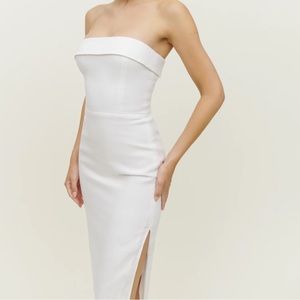 The Marcella is a strapless, midi dress, with a smocked back bodice.